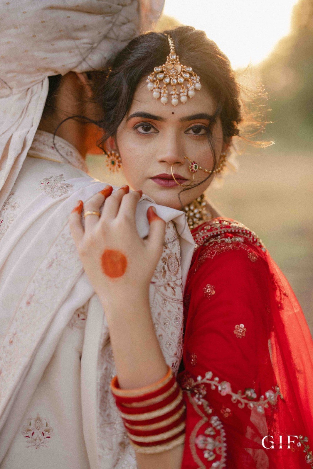 Abhishek and Mansi in a golden bridal portrait