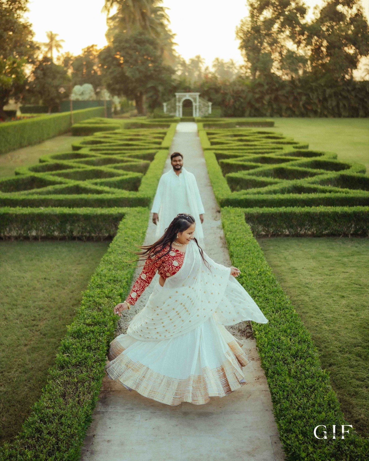 Dhruvin and Diksha sharing a playful garden moment