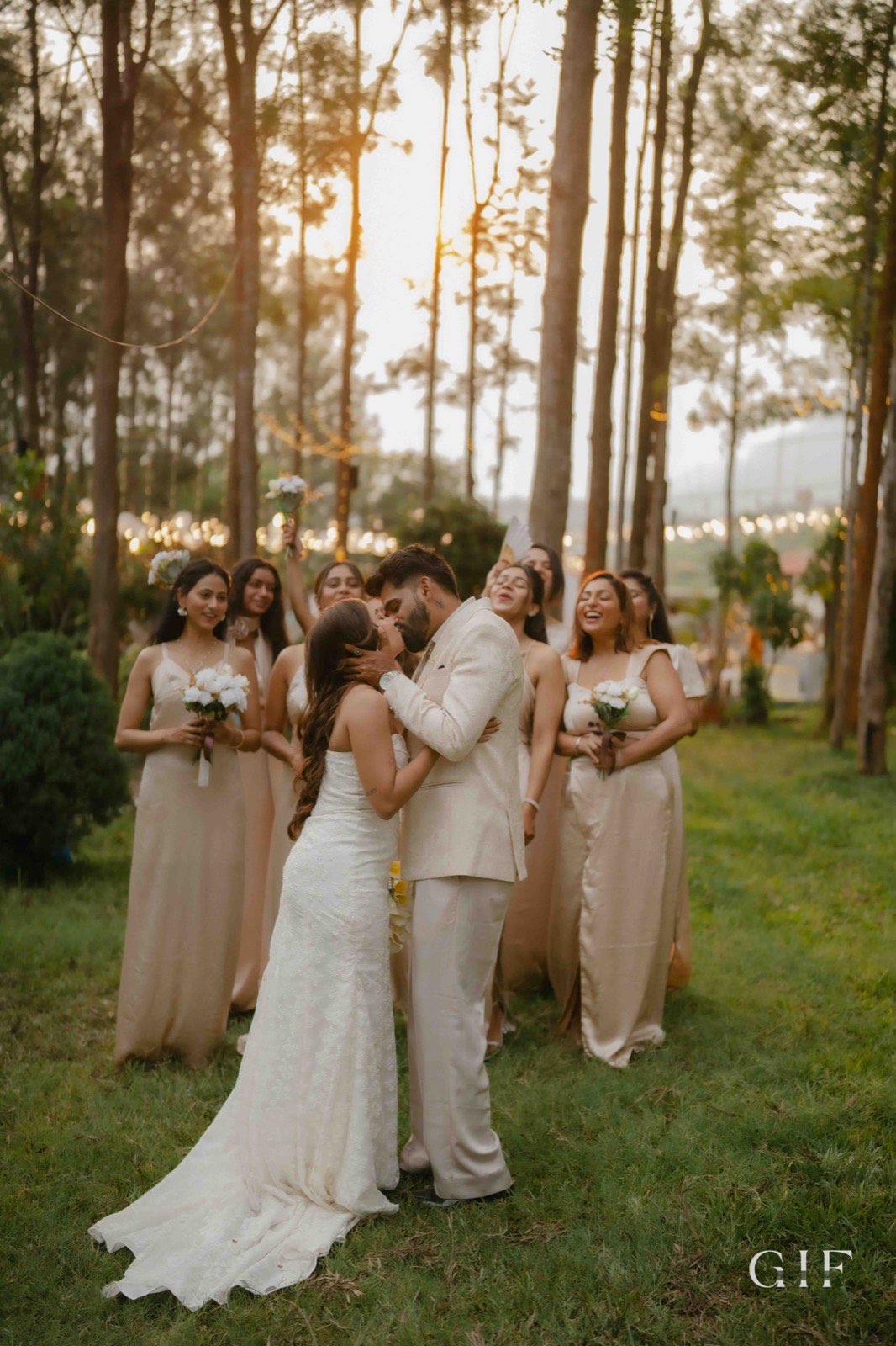 Kartik and Pranita kissing with their wedding party