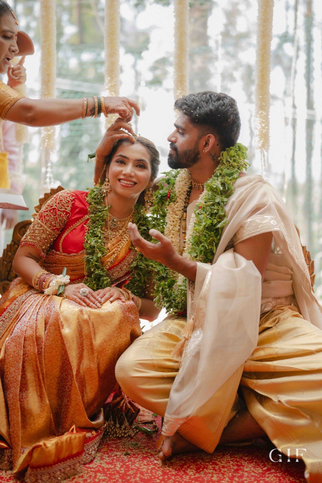 Kartik and Pranita receiving blessings during their ceremony