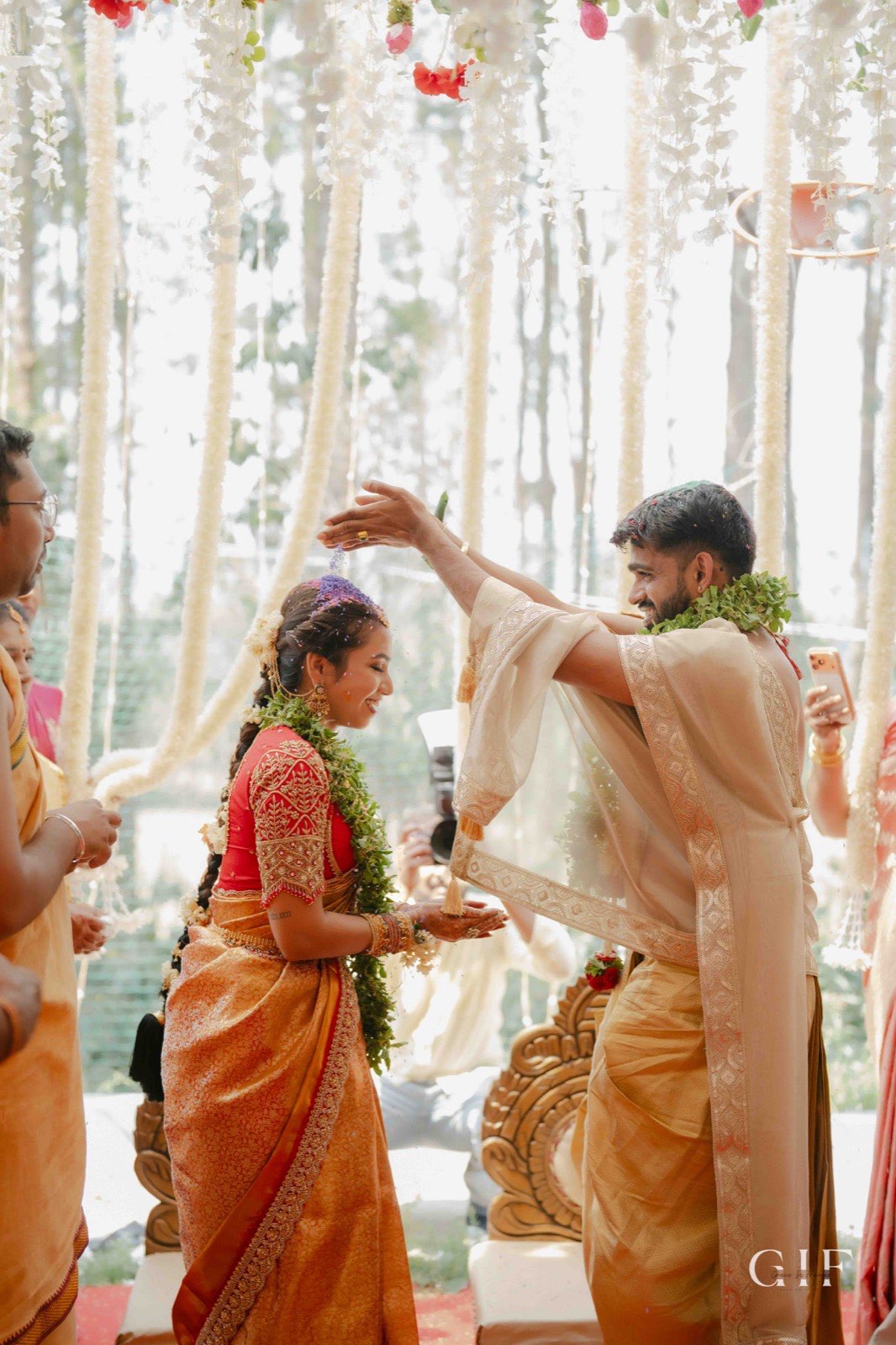 Kartik and Pranita enjoying a playful wedding ritual