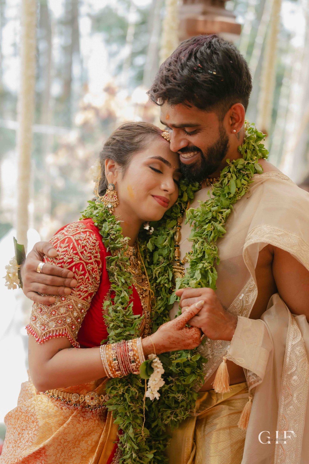 Kartik and Pranita embracing after their ceremony