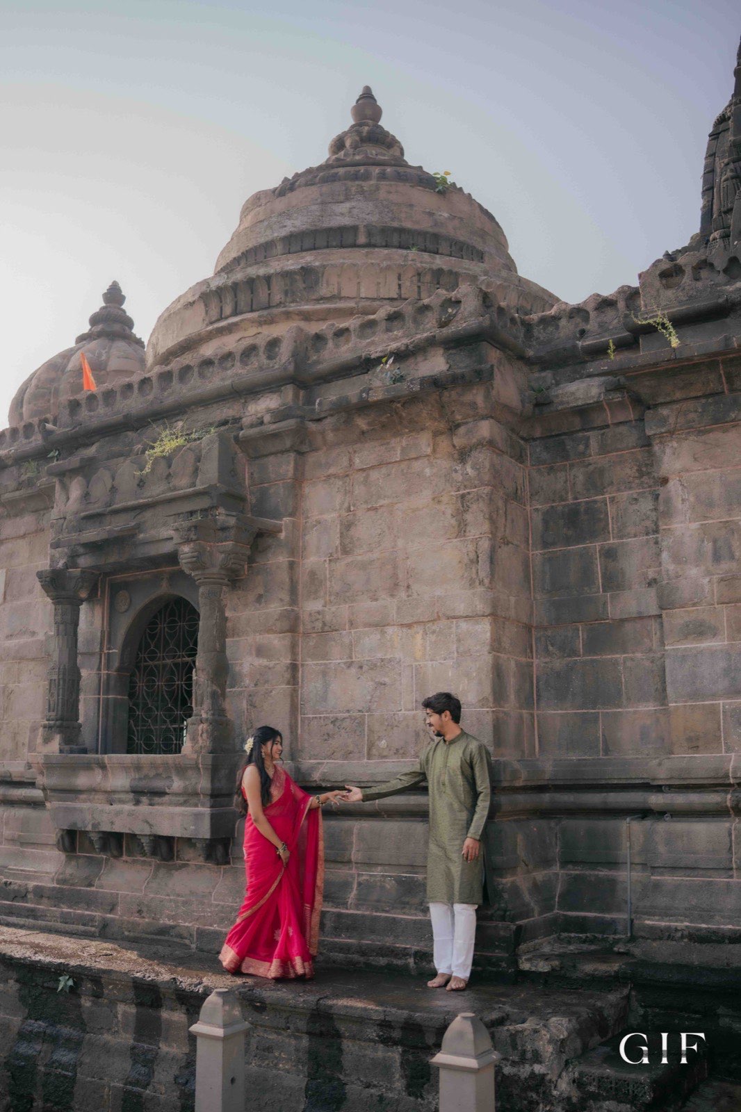 Ritesh and Neha beside a historic temple