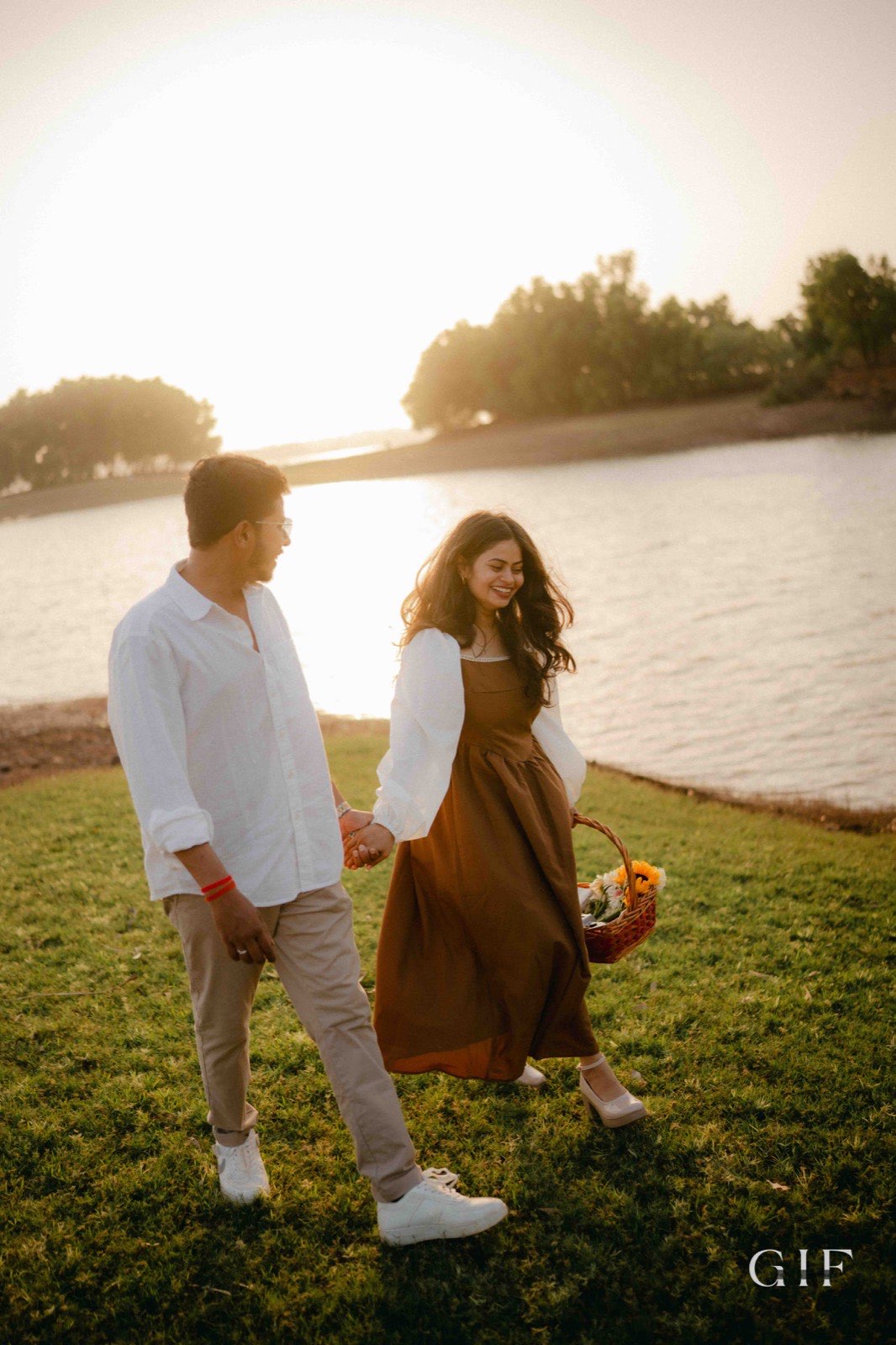 Niranjan and Pranali walking together at sunset