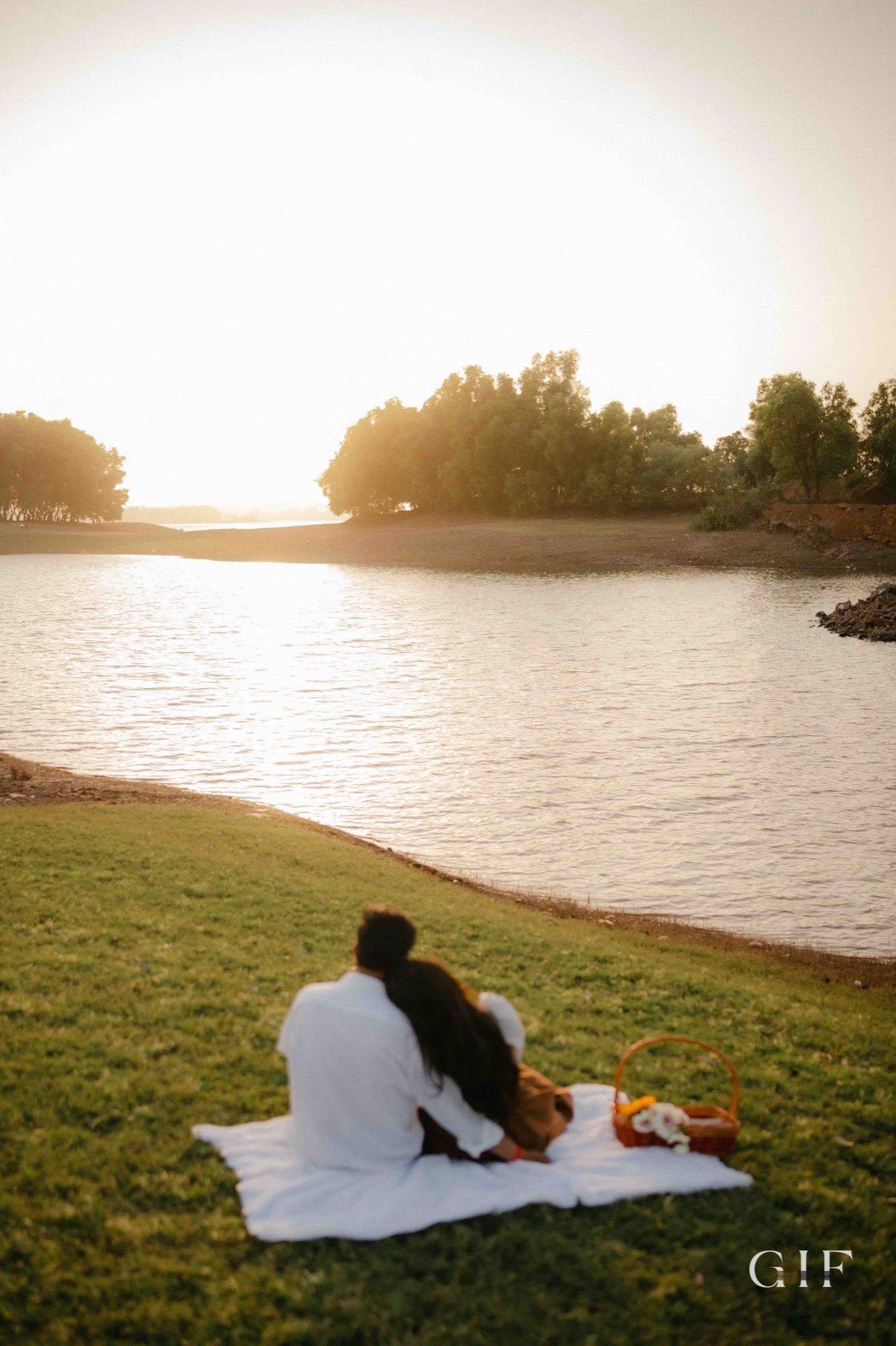 Niranjan and Pranali sitting together beside a lake