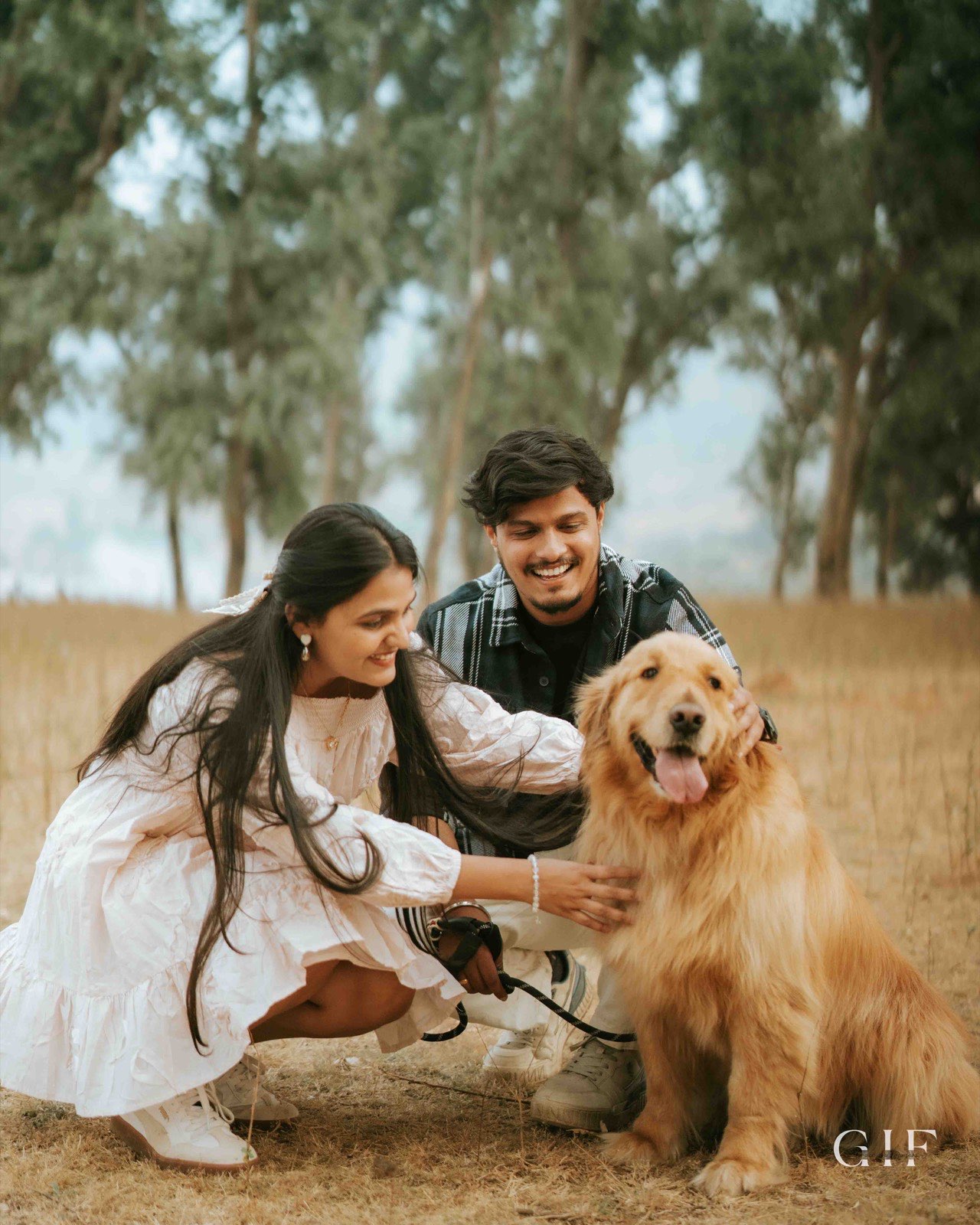 Shivam and Samruddhi playing with their golden retriever
